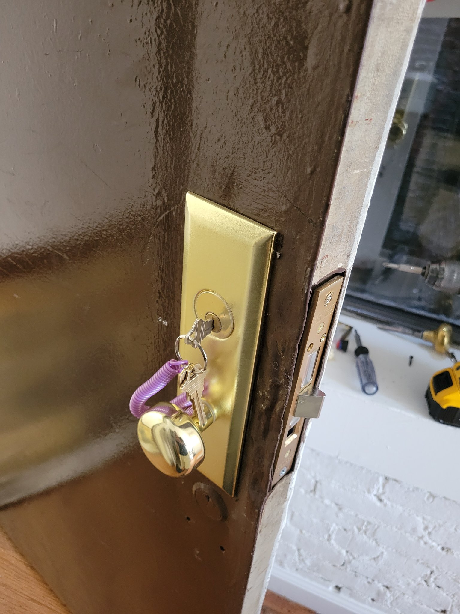 Smart keypad lock fitted to a pre-war residential door.